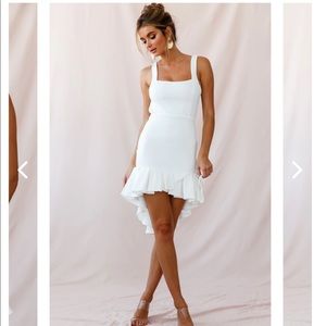 Never worn! open back, a pleated high-low hemline and a square neckline